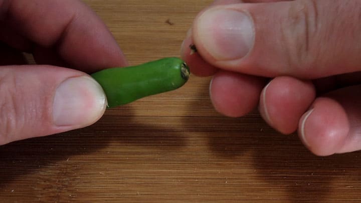 Chili pepper stem is removed. | secretsofcooking.com