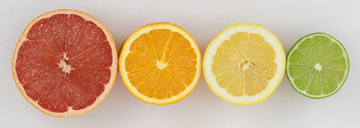 grapefruit, orange, lemon, lime, all cut in half