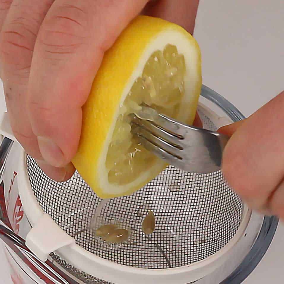 dinner fork juicing a lemon