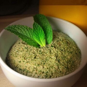 Peanut Mint Chutney in a bowl garnished with mint leaves.